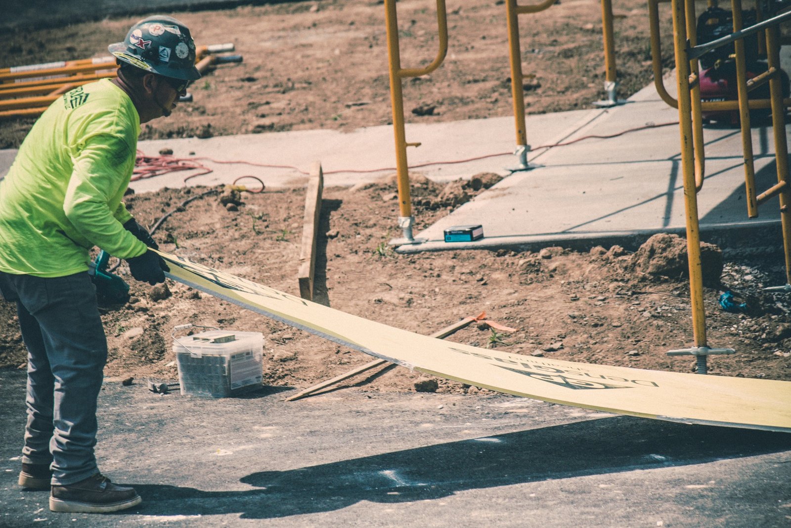 Safety inspector reviewing documents on a construction site in the UK